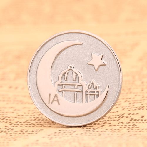 Round die-struck moon and castle badge pin with a simple circular outline