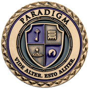 Custom challenge coin with a shield crest in purple and gold enamel