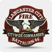 Custom embroidered fire department patch with eagle artwork, banner text and merrow border