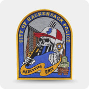 Custom embroidered police department patch with detailed illustration and gold merrow border