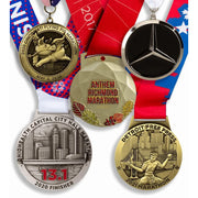 Custom marathon and half marathon finisher medals in antique gold and antique silver with printed ribbons