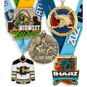 Custom hockey and wrestling medals including a die-cut jersey shape and a 3D cast design