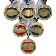 Matching series of custom tournament medals in antique gold with building relief and enamel centres