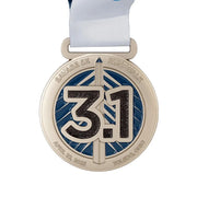 Custom 5K medal showing the 3.1 distance in navy enamel on a brushed gold face