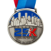 Antique silver custom race medal with a city skyline in relief and the distance in colour enamel