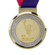 Polished gold custom marathon medal with a runner in relief and place names around the rim