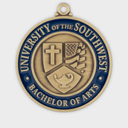 Custom graduation medal in antique gold with a blue enamel rim and a sculpted academic crest