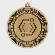Custom endowed professor medal in antique gold with a molecular emblem and laurel detailing