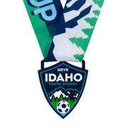 Custom soccer medal in a die-cut shield shape with navy and green enamel and a printed ribbon