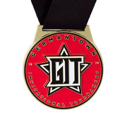 Custom invitational tournament medal in gold with red enamel and a star design, on a black ribbon